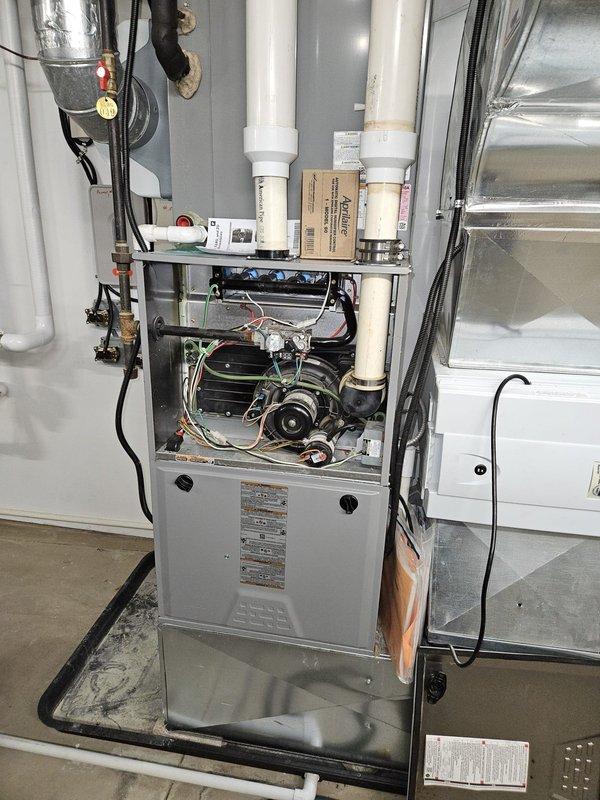 Responded to service call for non-operational furnace. Upon inspection, accessed internal components of residential HVAC system by removing front panel. Diagnosed issue with furnace, performed necessary repairs, and verified proper operation before closing access panels. System now functioning correctly.