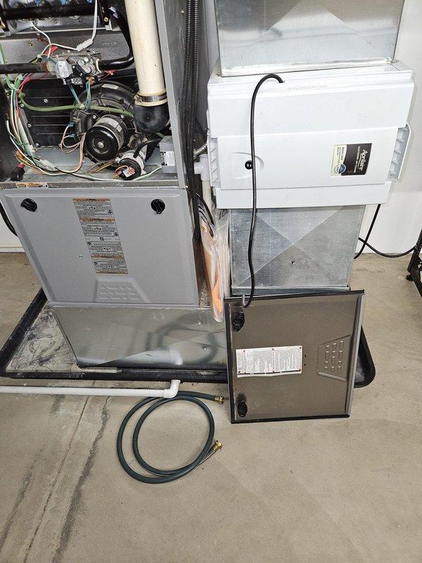 Responded to service call for non-operational furnace. Upon inspection, accessed internal components of residential HVAC system by removing front panel. Diagnosed issue with furnace, performed necessary repairs, and verified proper operation before closing access panels. System now functioning correctly.