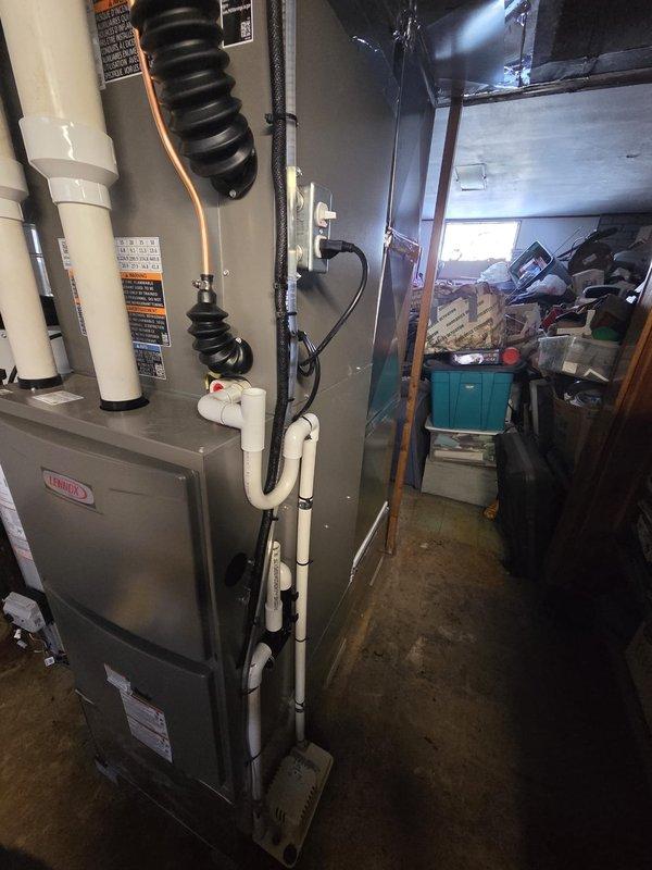 Completed retrofit installation of Lennox furnace with integrated AC system. Installed new ductwork through block wall with proper penetration and sealing. Connected all necessary drainage lines, electrical components, and verified system operation according to manufacturer specifications.