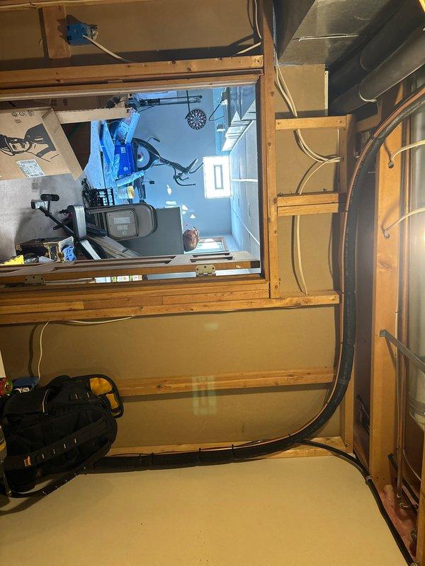 Successfully completed installation of a Lennox residential heating system, converting from geothermal to a conventional furnace with AC. System includes proper PVC venting and ductwork connections in the utility area, with all components securely mounted and professionally installed according to manufacturer specifications.