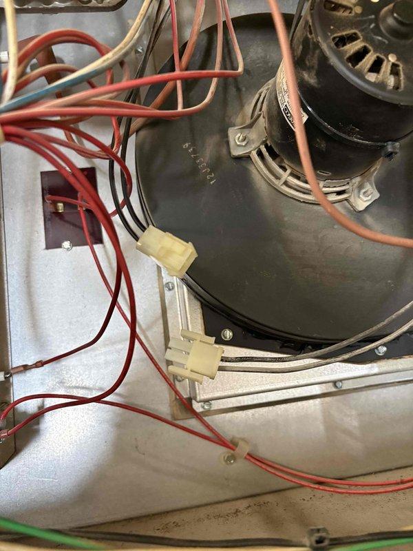 Performed furnace repair service on commercial unit. Replaced failed blower motor with new component, removing protective packaging and connecting wiring harness with appropriate terminal connections. Verified proper installation and operation after replacement.