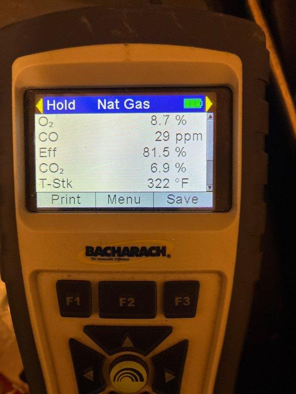 Responded to emergency service call for newly installed heater (October installation) not producing heat. Diagnostic inspection revealed deterioration and moisture damage on interior surfaces. Combustion analysis performed with Bacharach analyzer showed system operating at 81.5% efficiency with O₂ at 8.7%, CO at 29 ppm, CO₂ at 6.9%, and stack temperature at 322°F. Adjusted combustion parameters to restore proper heating function.