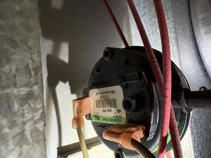 Diagnosed Reznor unit with no heat complaint. Found faulty pressure switch preventing proper operation. Inspected blower motor assembly and discovered worn belt. Replaced pressure switch and drive belt, restoring proper heating function to the commercial unit.