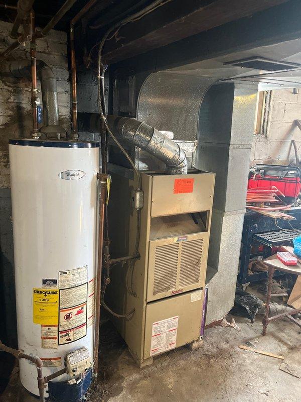 Completed furnace replacement in basement utility area due to no-heat condition. Installed new furnace unit with proper connections to existing ductwork system. Ensured proper clearance from water heater and verified all connections were secure and operational before completion.