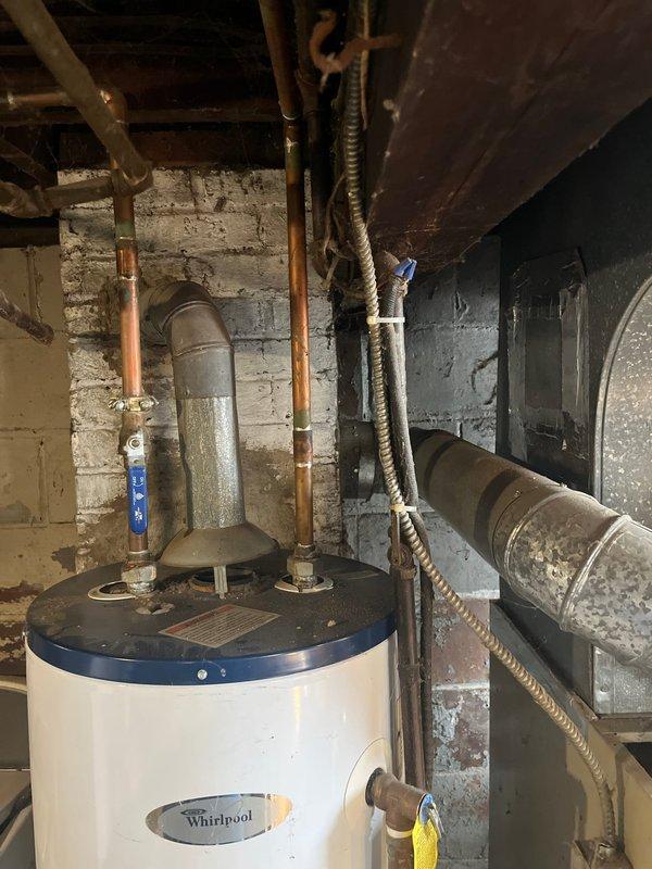 Completed furnace replacement in basement utility area due to no-heat condition. Installed new furnace unit with proper connections to existing ductwork system. Ensured proper clearance from water heater and verified all connections were secure and operational before completion.