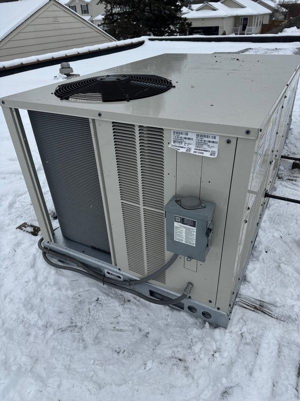 Successfully installed a Bryant RTU on commercial property during winter conditions. Cleared accumulated snow from unit and surrounding area to ensure proper ventilation and access. Completed installation with all electrical connections and verified system operation.