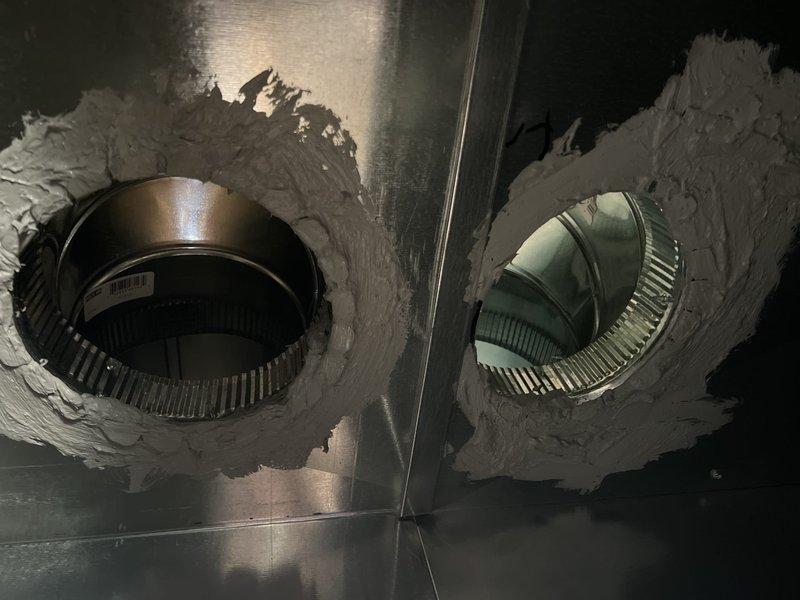 Completed installation of new HVAC ductwork system in unfinished construction space. Installed main supply trunk with properly secured round takeoffs and applied mastic sealant at all connection points to ensure airtight system integrity. Verified proper placement and support of ductwork between structural framing elements.