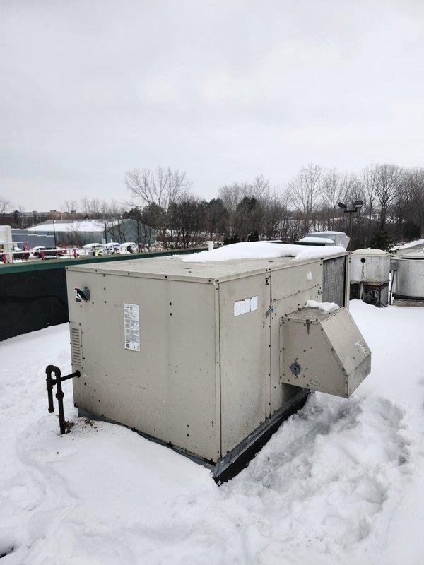 Responded to commercial no-heat call for rooftop unit. Inspection revealed severe corrosion at heat exchanger seam with visible deterioration of metal components. Unit requires replacement due to compromised heat exchanger integrity and safety concerns.