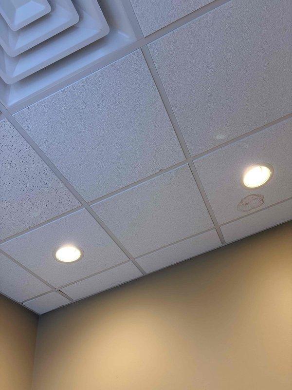 Responded to commercial furnace service call for non-operational system. Inspected and replaced dirty air filter that was restricting airflow. Noted water staining on ceiling tile near air diffuser which may indicate previous condensate leak. System functioning properly after service.