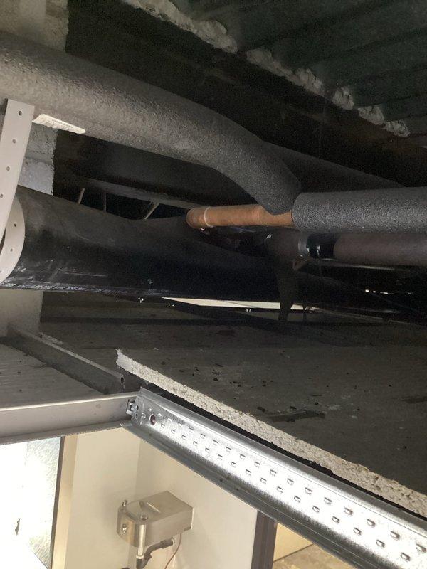 Conducted inspection of ceiling infrastructure to evaluate plumbing system integration requirements. Examined existing HVAC ductwork and copper pipe connections within the structural framework. Assessed overhead truss system and support beams for proper placement of new piping components and evaluated insulation needs for optimal system performance.