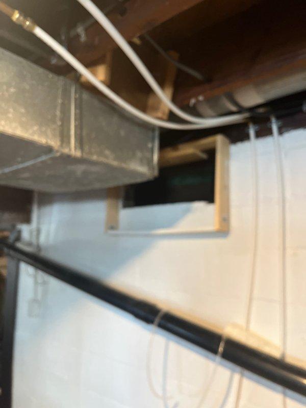 Performed inspection of 45-year-old Conquest 80 furnace system to prepare estimate for replacement. Evaluated existing ductwork configuration, noting inadequate return air and missing bathroom supply. Documented current installation with photos showing outdated plenum design and suboptimal duct routing through floor joists. Customer requires comprehensive quote for new furnace, A/C unit, dehumidifier, and correction of existing ductwork deficiencies.
