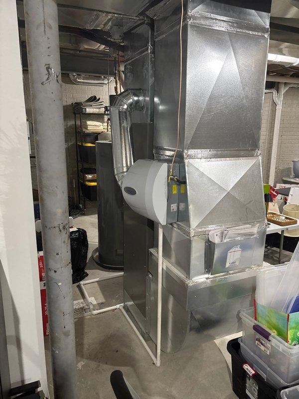 Successfully installed two AprilAire whole-house humidifiers in the client's HVAC system. Units were properly integrated with the existing Lennox furnace, complete with all necessary ductwork connections, PVC drainage piping, and water supply lines. Final inspection confirmed proper operation of both humidifiers with no leaks detected.