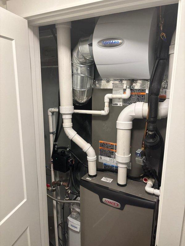 Successfully installed two AprilAire whole-house humidifiers in the client's HVAC system. Units were properly integrated with the existing Lennox furnace, complete with all necessary ductwork connections, PVC drainage piping, and water supply lines. Final inspection confirmed proper operation of both humidifiers with no leaks detected.