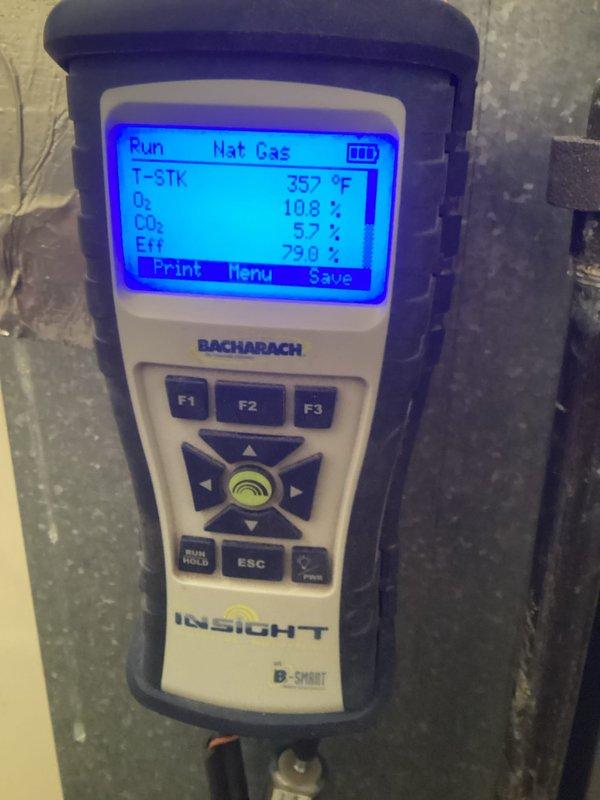 Performed routine maintenance on a 4-year-old furnace. Conducted combustion analysis using Bacharach INSIGHT gas analyzer, which revealed stack temperature of 357°F, O₂ at 10.8%, CO₂ at 5.7%, and system efficiency of 79.0%. CO readings were at acceptable levels (18 ppm). Unit is functioning within normal parameters.