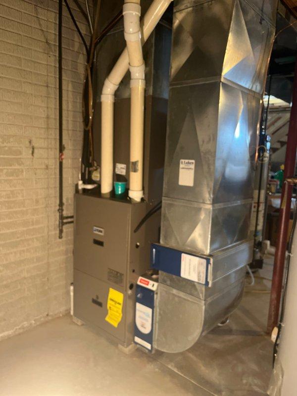 Completed full system replacement in basement mechanical room, installing new Lennox equipment with all necessary ductwork, PVC venting, and electrical connections. System includes furnace unit with attached humidifier and proper exhaust configuration. Customer eligible for Lennox rebates.