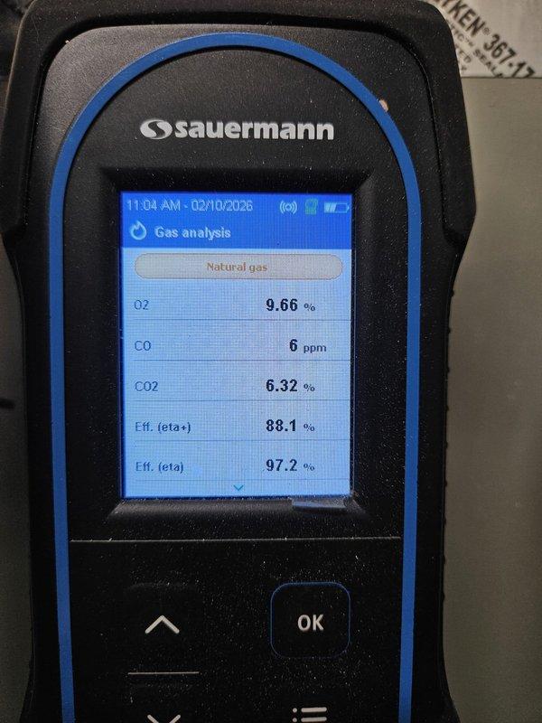 Responded to service call for non-operational garage furnace (approx. 1 year old). Performed combustion analysis using Sauermann gas analyzer, which confirmed proper operation with acceptable CO levels (6-8 ppm), good oxygen readings (8.92-9.66%), and excellent efficiency ratings (88.1-89.0% eta+, 97.2-98.2% eta). System now functioning within manufacturer specifications.
