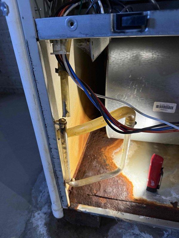 Responded to emergency service call for 6-year-old furnace exhibiting water damage. Upon inspection, found significant rust formation at bottom of furnace compartment, indicating prolonged moisture exposure. Completed necessary repairs to address water infiltration issue and restore proper operation.