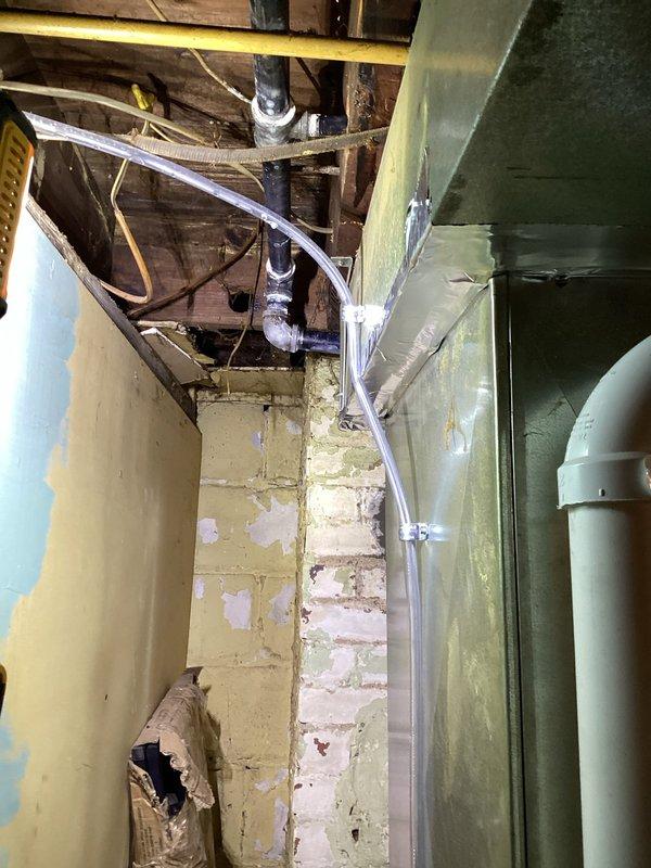 Successfully replaced existing furnace and installed new Bradford White water heater with expansion tank for Summit Co HWAP program. Complete installation included connecting all necessary plumbing (copper and PVC) and properly securing HVAC ductwork with appropriate insulation and tape sealing at joints. System was tested and verified operational in basement utility area.