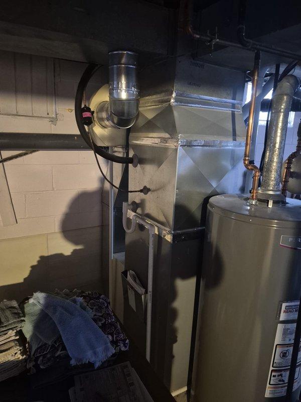 Performed fall maintenance service on residential heating system. Inspected furnace, ductwork, and ventilation components - all found in good working condition with proper connections. No issues identified with the HVAC equipment or associated PVC exhaust system.