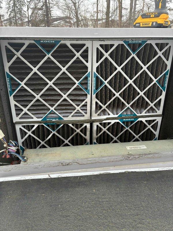 Performed fall/winter maintenance service on commercial HVAC system. Inspected and evaluated Koch air filters in the air handling unit, noting accumulated dust and wear indicating end of service life. Utilized specialized tools to access and service components as part of scheduled preventative maintenance protocol.