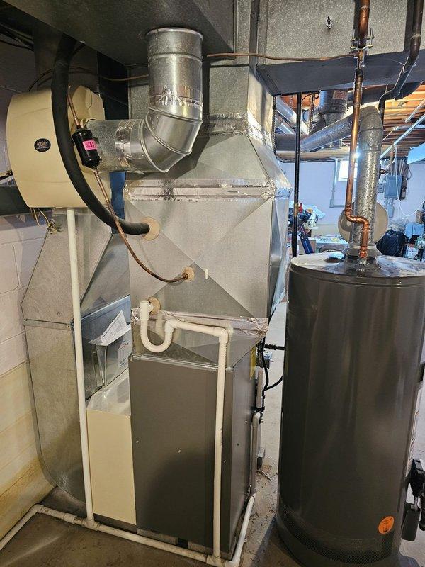 Successfully installed a new high-efficiency furnace in the basement utility room, including proper connection to existing ductwork with sealed joints and installation of PVC ventilation pipes. All electrical connections were completed according to code, and the system was tested for proper operation alongside the existing water heater.