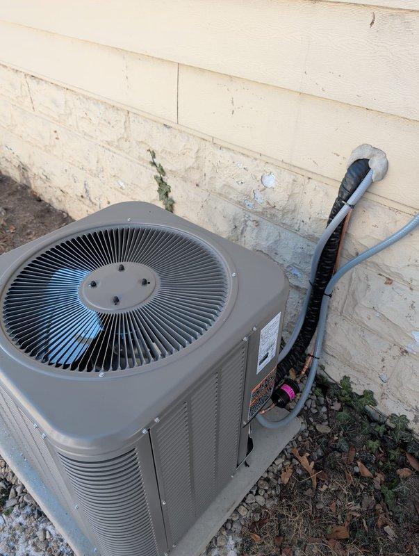 Successfully installed a new Lennox ML13XC1-018-230A02 condensing unit operating on R-410A refrigerant. Unit was properly positioned on a gravel base with concrete pad, with insulated refrigerant lines routed and secured to the exterior wall through appropriate wall penetration. System was charged according to manufacturer specifications and verified for proper operation.