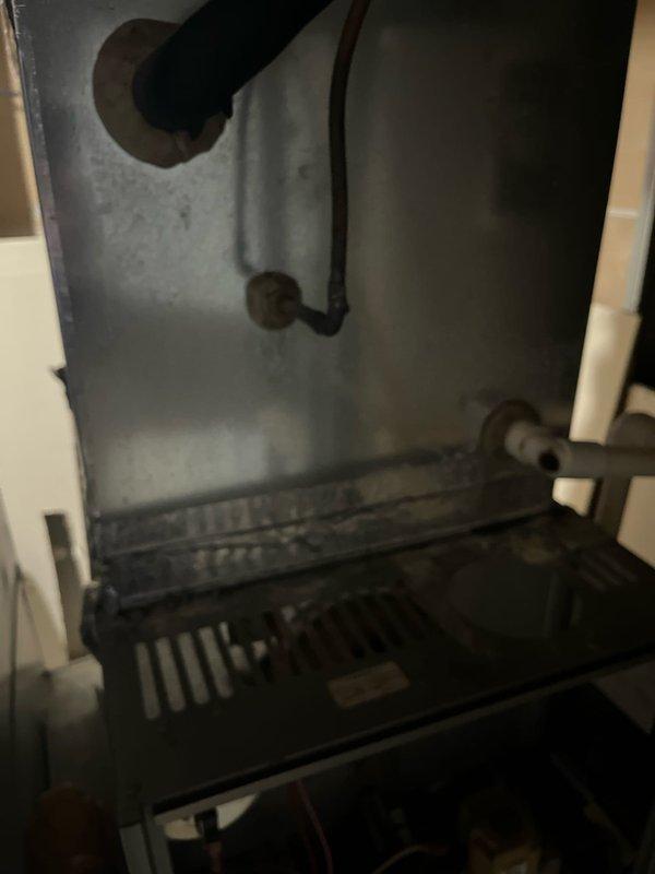 Conducted inspection of non-functioning furnace with no heat output. Visual examination revealed an aging heat exchanger with significant wear, corroded burner assembly, and deteriorated internal components. Recommended complete system replacement due to age, condition, and potential safety concerns.