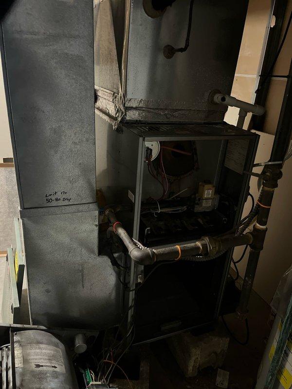 Conducted inspection of non-functioning furnace with no heat output. Visual examination revealed an aging heat exchanger with significant wear, corroded burner assembly, and deteriorated internal components. Recommended complete system replacement due to age, condition, and potential safety concerns.
