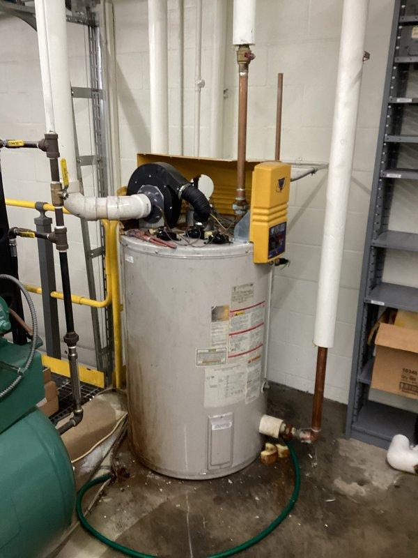 Successfully installed a new water heater in the utility room, replacing the previous unit which showed signs of wear and staining. Completed all necessary plumbing connections including PVC and copper piping, and ensured proper installation of safety equipment. System was tested and confirmed to be in proper functioning condition.
