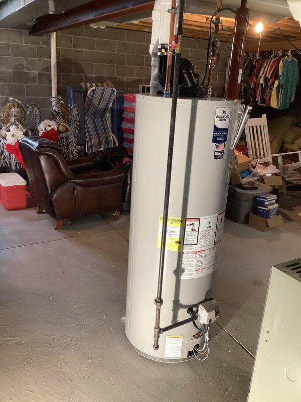 Successfully installed a new 50-gallon Bradford White power vent water heater as requested by customer. Completed proper connections to existing PVC venting system and copper water lines, and verified proper operation before completing the job.