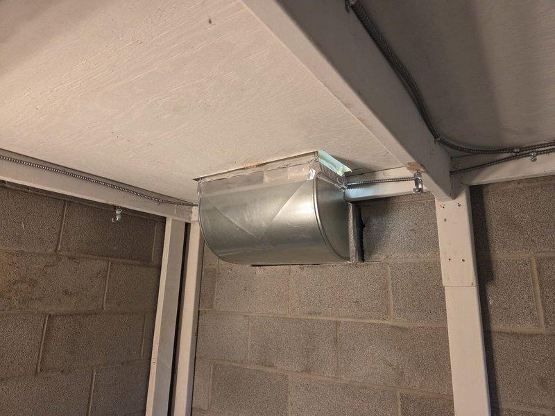 Installed new Lennox furnace in basement utility room with associated PVC vent pipes. Completed connection to existing ductwork including rectangular-to-round transition fitting. Mounted digital thermostat on adjacent wall and verified proper system operation.