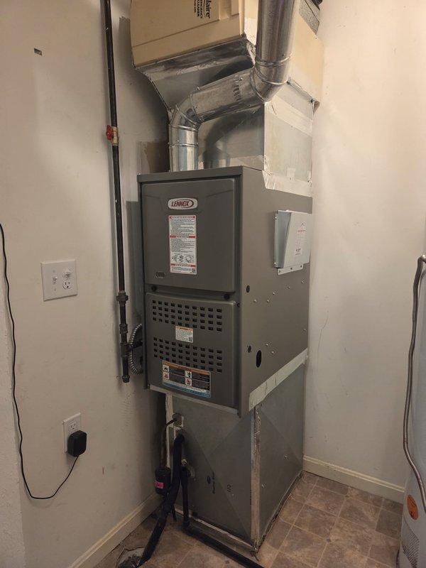 Successfully installed a new Lennox furnace in the utility room, including proper connection to existing ductwork with all joints sealed using foil tape. System was mounted with appropriate clearances for maintenance access and connected to electrical and gas supply lines, completing a fully functional heating system.