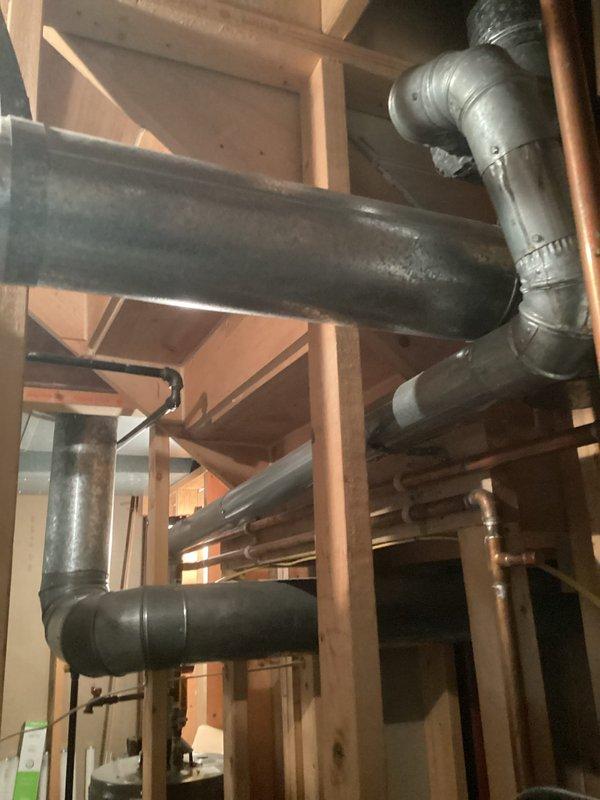 Responded to service call regarding noise from recently installed unit. Inspected electrical connections and control unit in mechanical area, finding all components properly secured and operational (green indicator light confirmed). Examined HVAC ductwork and connections throughout the wooden framing structure, verifying proper installation with no issues that would cause abnormal noise during operation.
