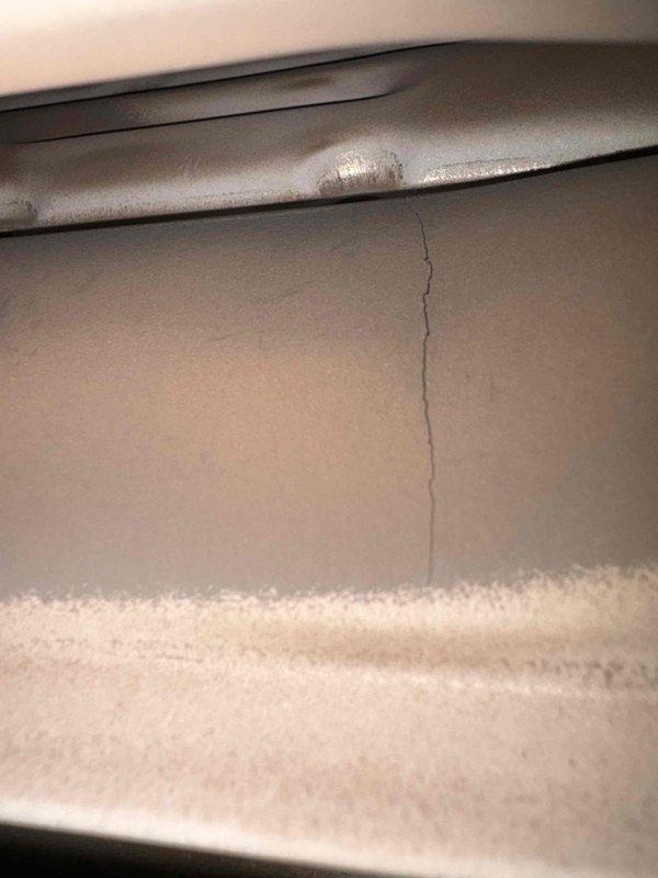 Performed scheduled fall/winter maintenance inspection. Documented structural concerns including a significant vertical crack in the interior wall and noted wear on exterior panels. Photographic evidence collected for documentation purposes.