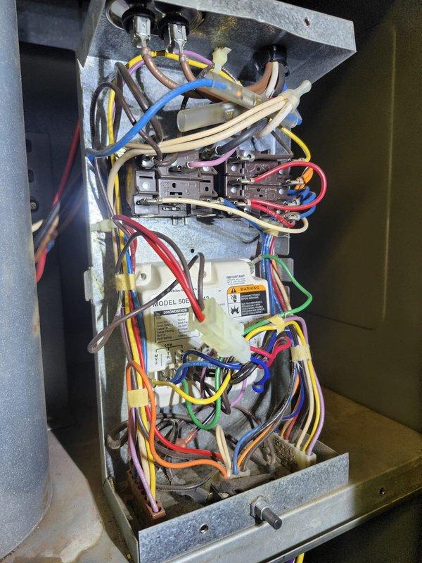Responded to complaint of furnace not clicking on with erratic thermostat display and water line leak. Inspected control board and electrical components, finding loose wiring connections at the pressure switch. Repaired connections and addressed condensate drain line blockage to resolve water leak issue. System now operating properly with stable thermostat function.