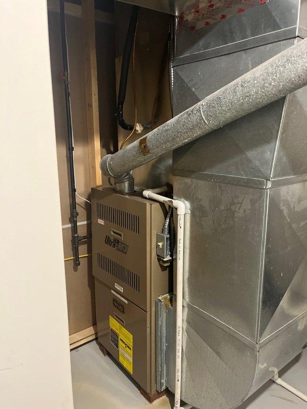 Provided quotation for furnace replacement to address draft motor failure in existing unit. Current system remains operational but showing signs of component deterioration. Inspection of installation area revealed adequate ductwork connections and sufficient space for new equipment installation with proper ventilation requirements.