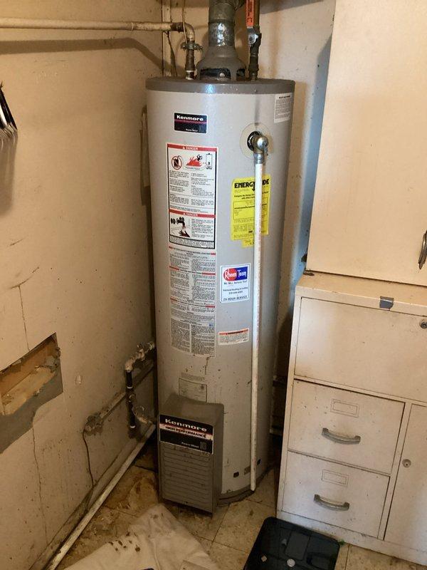 Responded to service call for leaking Kenmore water heater. Upon inspection, confirmed tank failure requiring complete replacement. Installed new water heater, connected to existing copper and PVC plumbing system, and verified proper operation before leaving premises.
