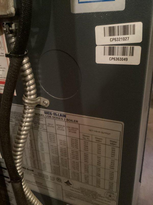 Performed comprehensive inspection on 10-year-old Weil-McLain LGB Series 2 boiler system. Visual examination revealed properly installed components including copper/black piping network, pressure gauges, and pump assembly all in working condition. Documented system specifications and component status with digital photography for service records.
