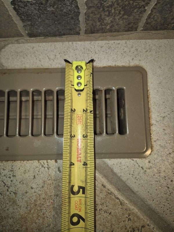 Responded to no heat complaint - diagnosed faulty thermostat (2 years old) affecting system operation. Performed measurements of supply and return air registers (5-6" dimensions noted) and observed significant rust/corrosion in return air housing that could impact airflow. Replaced thermostat and restored heating functionality to Modulating Variable Performance system (2025 MVP).