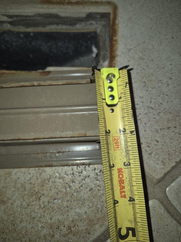 Responded to no heat complaint - diagnosed faulty thermostat (2 years old) affecting system operation. Performed measurements of supply and return air registers (5-6" dimensions noted) and observed significant rust/corrosion in return air housing that could impact airflow. Replaced thermostat and restored heating functionality to Modulating Variable Performance system (2025 MVP).