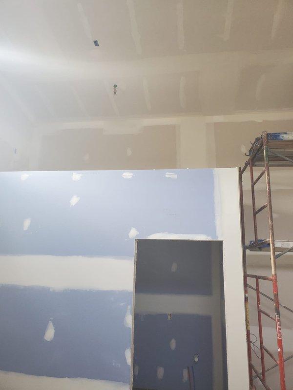 Conducted a comprehensive site assessment for HVAC new construction estimate at an interior renovation project. Evaluated installation requirements in a partially completed space with ongoing drywall work and scaffolding in place. Documented existing conditions and determined optimal placement for HVAC components based on the current construction phase.