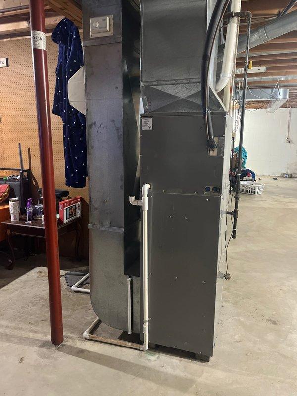 Conducted site assessment of existing HVAC system in basement utility area, including evaluation of aging Belcary furnace unit and associated ductwork. Documented current installation conditions and prepared replacement estimate for complete system upgrade to improve efficiency and reliability.