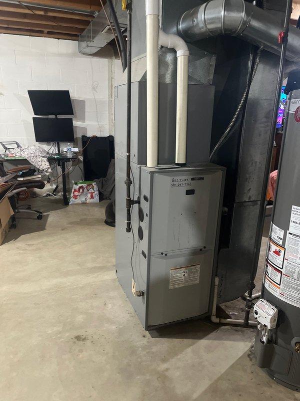 Conducted site assessment of existing HVAC system in basement utility area, including evaluation of aging Belcary furnace unit and associated ductwork. Documented current installation conditions and prepared replacement estimate for complete system upgrade to improve efficiency and reliability.