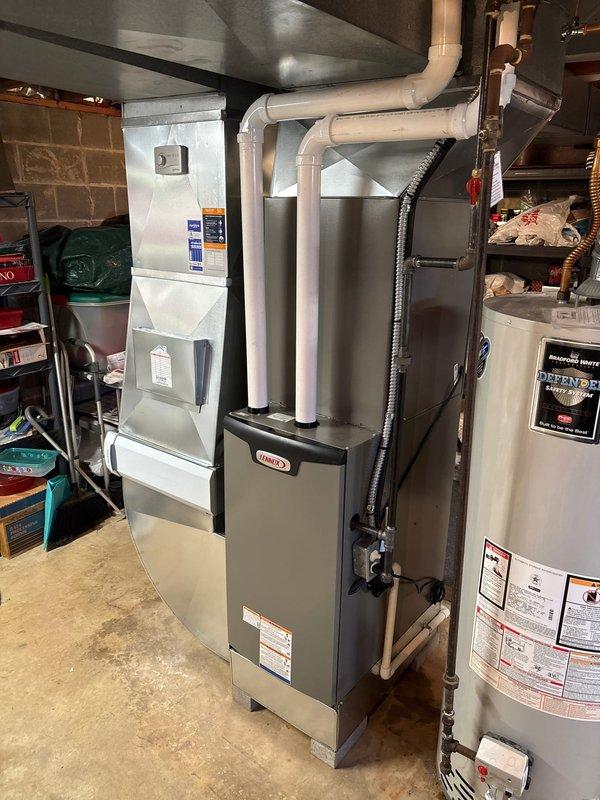 Successfully completed a furnace/AC retrofit installation in the basement, featuring a new Lennox furnace system with properly connected PVC venting, ductwork, and humidifier. Installation included all necessary electrical connections, copper line sets, and proper exhaust ventilation, with all components tested for optimal operation.