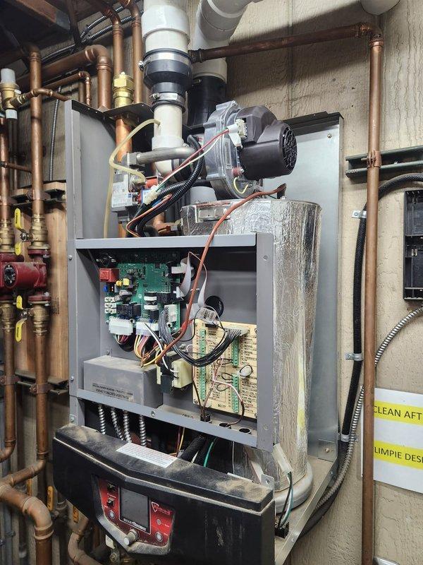 Responded to maintenance garage boiler lockout condition. Inspected Lochinvar boiler system and control panel components. Resolved lockout issue by resetting control board and verifying proper operation of all associated valves, pumps, and venting system.