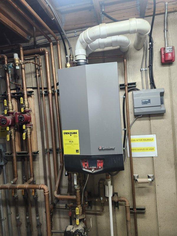 Responded to maintenance garage boiler lockout condition. Inspected Lochinvar boiler system and control panel components. Resolved lockout issue by resetting control board and verifying proper operation of all associated valves, pumps, and venting system.