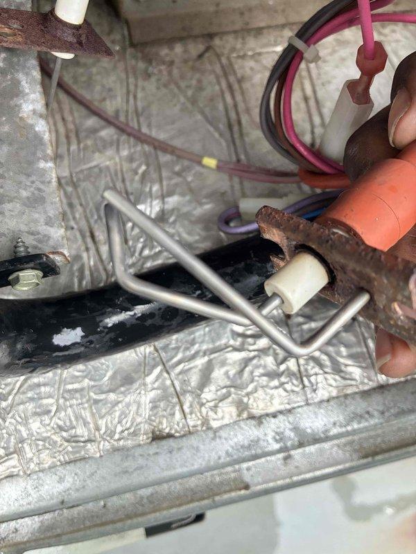 Performed scheduled commercial heating system maintenance and inspection. Observed significant corrosion on evaporator coil assembly with rust development on metal components. Documented electrical wiring condition and identified deterioration of mounting brackets requiring future attention.