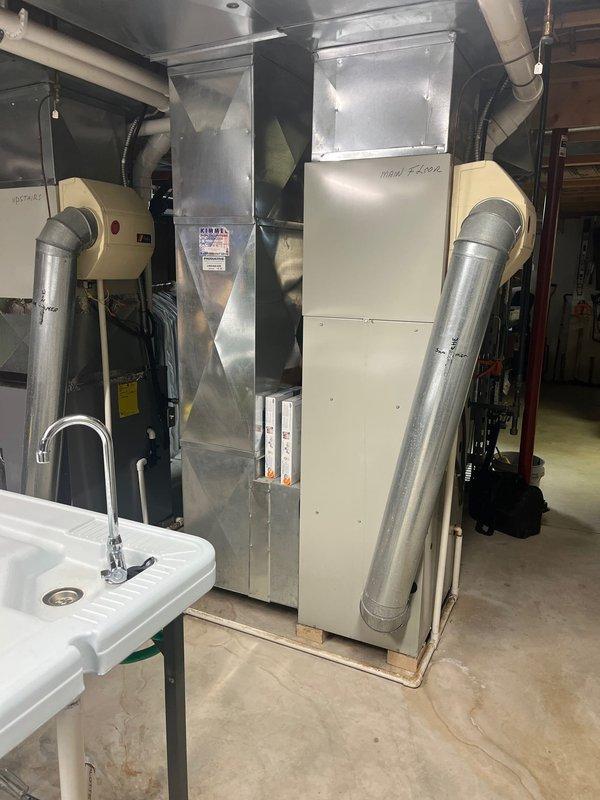 Conducted inspection of aging furnace system in basement utility room that customer reported was producing excessive noise during operation. Examined existing HVAC setup, which includes central furnace unit with extensive ductwork distribution system and standard residential connections. Recommended complete replacement of the furnace unit due to age-related deterioration and operational inefficiency, while maintaining compatibility with the existing ductwork configuration.