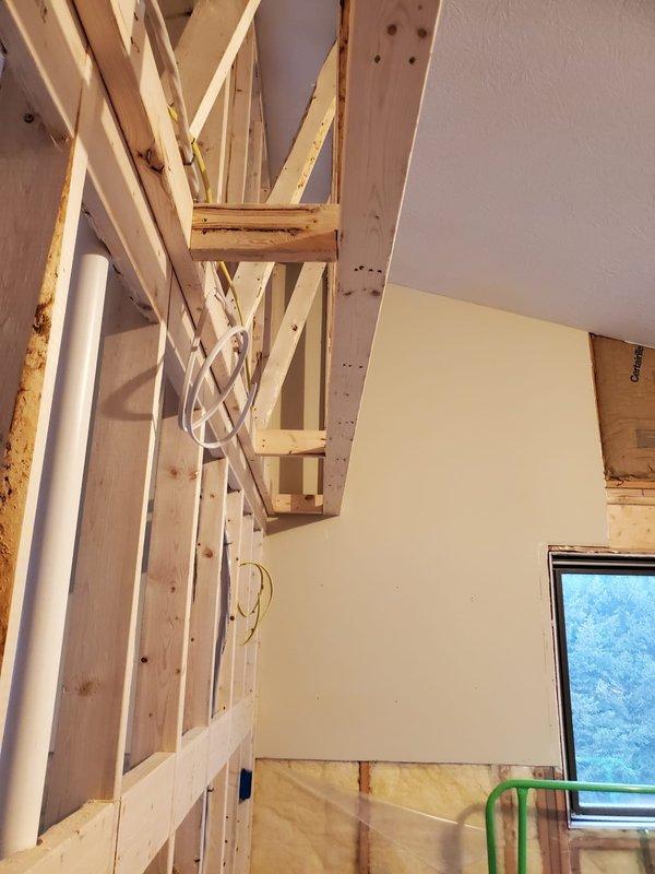 Conducted inspection of exposed framing to evaluate installation requirements for bathroom exhaust fans, microwave exhaust, and associated ductwork. Documented existing structural conditions with photos, noting electrical wiring paths and available connection points through wooden joists. Performed preventative maintenance on system components affected by snow accumulation.