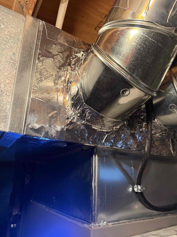 Responded to customer concern regarding unsealed ductwork at the furnace connection following new furnace installation. Inspected and verified proper sealing of ductwork connections with metallic tape as evidenced by photos. Addressed customer's request to reinstall bedroom damper that was removed during original installation.